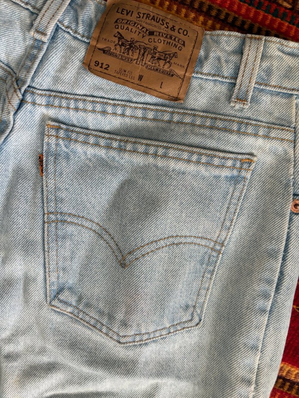 Vintage USA Made Levi’s 912 Orange Tab Light Wash High Waist Mom Jeans 28x32